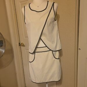 NEW Off White Sleeveless  Top and Mini Skirt with Black Trim.